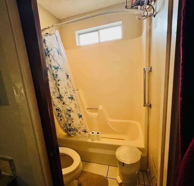 Old fiberglass shower stall before remodeling
