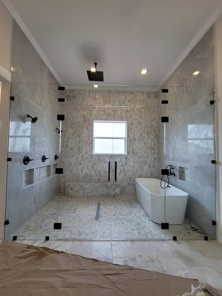 Bathroom remodel Corpus Christi — glass-enclosed shower with tub