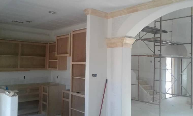Custom cabinet framing and arch construction in progress in Corpus Christi