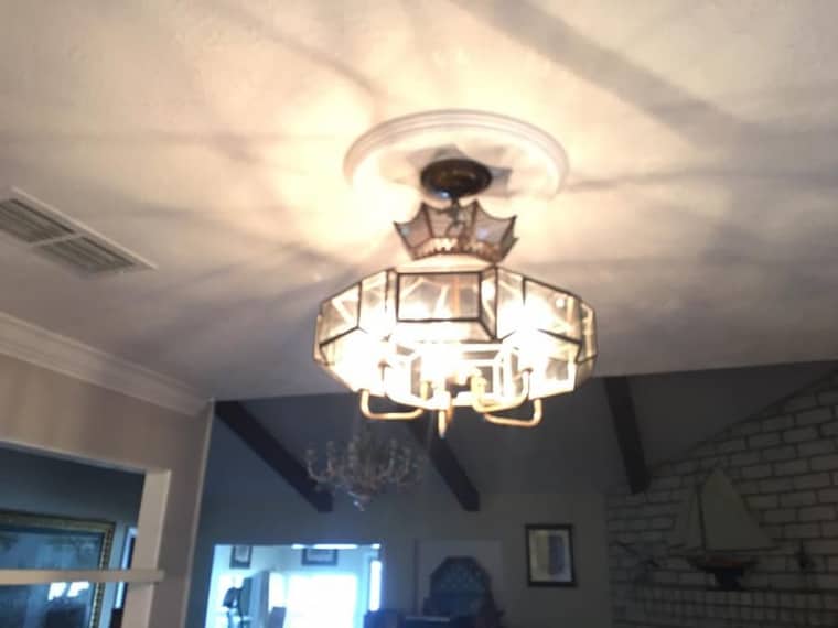 Vintage chandelier and light fixture installation in Corpus Christi home