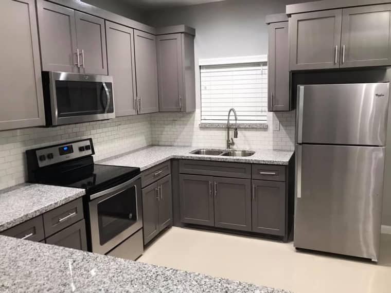 Modern gray cabinet kitchen remodel with granite countertops in Corpus Christi