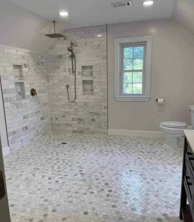 Walk-in shower with hexagonal marble floor tile in Corpus Christi