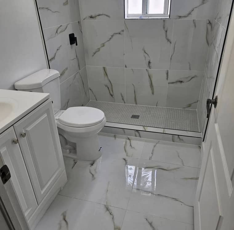 Full bathroom remodel with marble tile floor and walk-in shower Corpus Christi