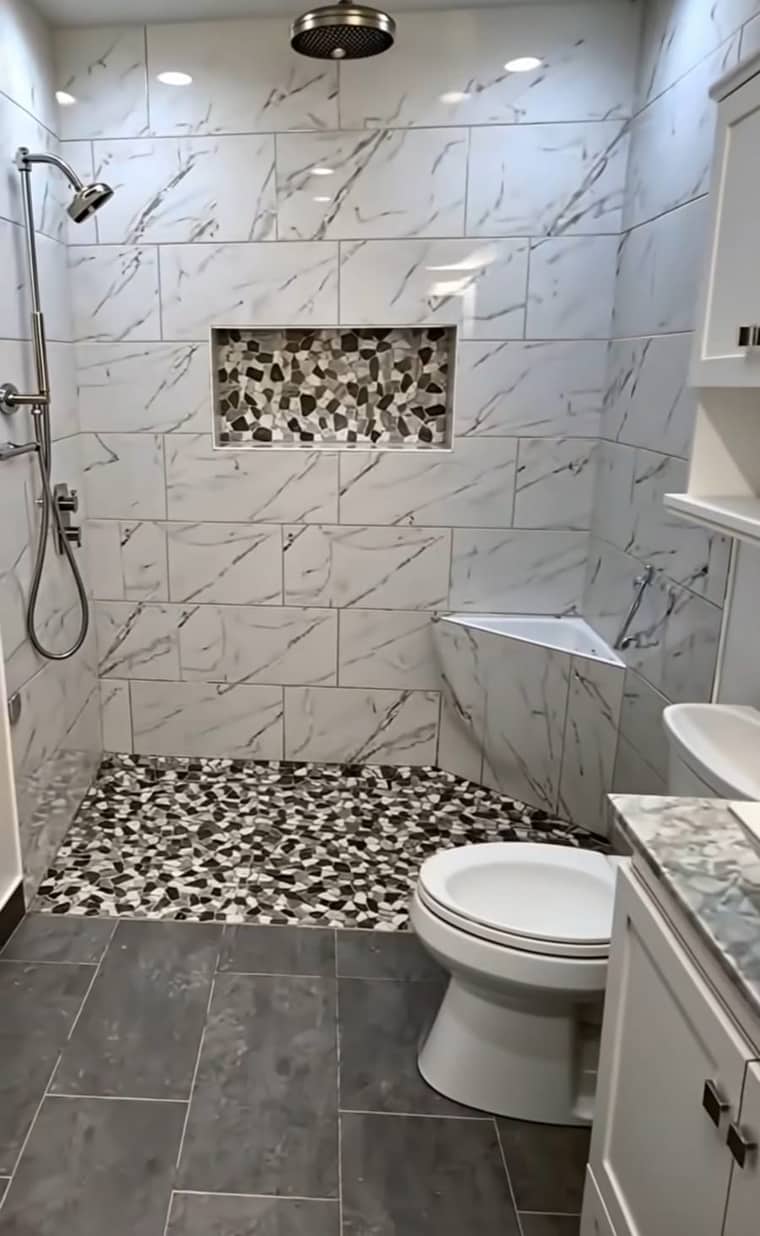 Walk-in shower with mosaic tile floor and niche in Corpus Christi