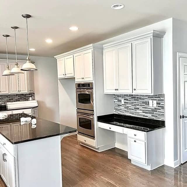 White cabinet kitchen remodel with granite countertops in Corpus Christi