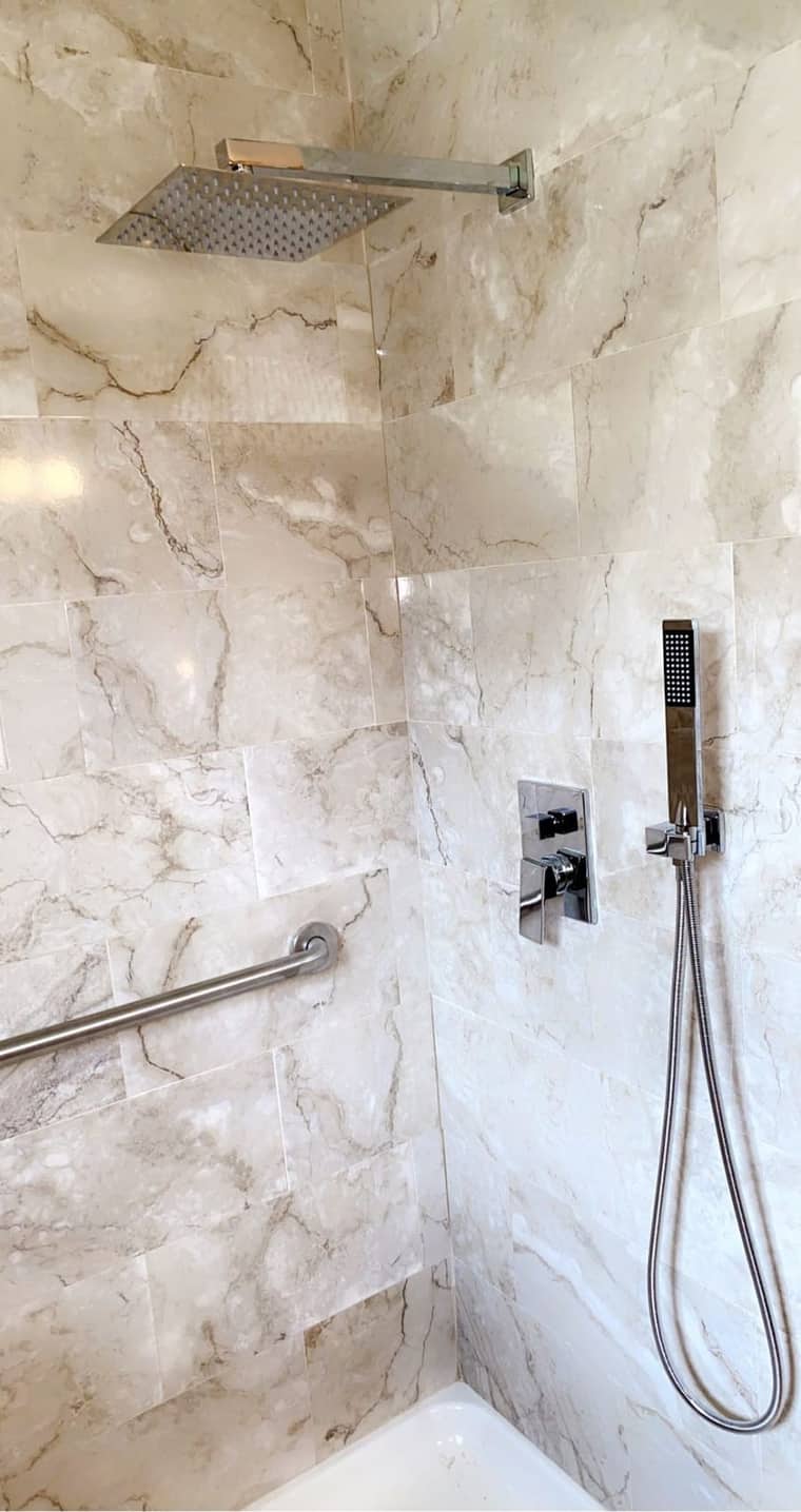 Rain shower head with marble tile installation in Corpus Christi
