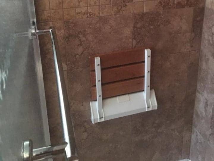 Barrier-free walk-in shower with grab bars in a Corpus Christi home