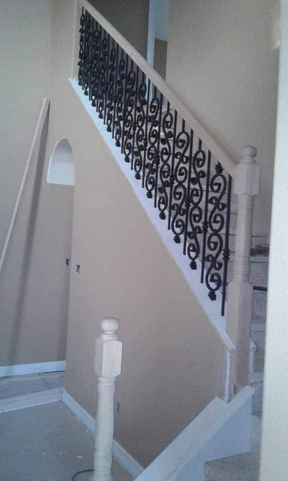 Wrought iron staircase railing installation in Corpus Christi home