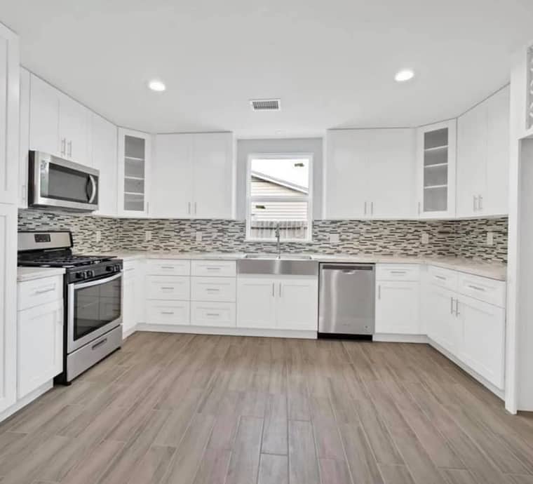 Kitchen renovation Corpus Christi — white shaker with mosaic backsplash