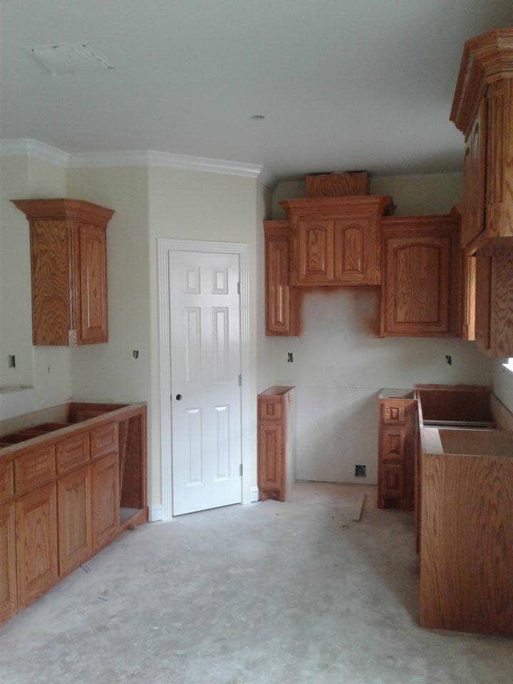 Oak kitchen cabinet installation with crown molding in Corpus Christi
