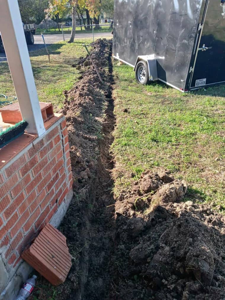Exterior sewer line trench excavation in Corpus Christi