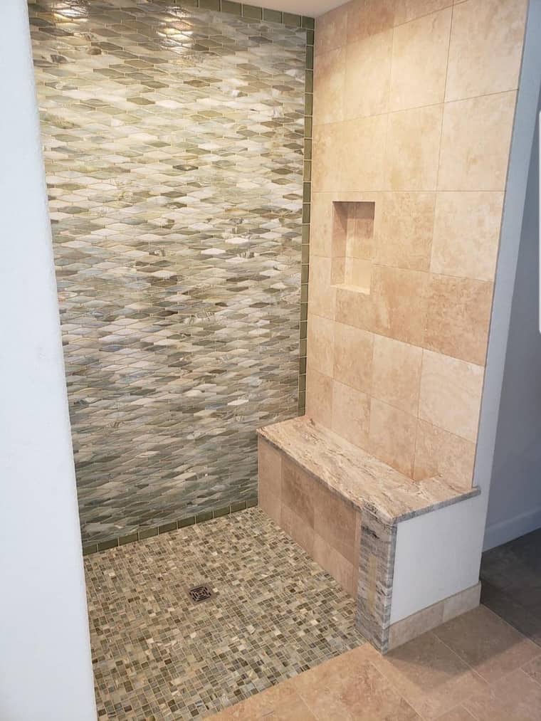 Custom mosaic tile shower with marble bench and niche in Corpus Christi