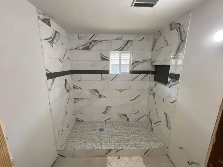 Shower remodel Corpus Christi — marble tile with accent strip
