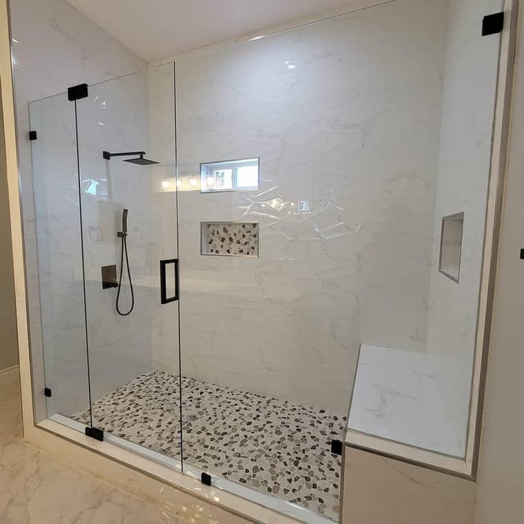 Walk-in shower Corpus Christi — frameless glass with pebble floor